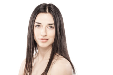 Fototapeta premium studio portrait of a beautiful young girl against white backgroung. looking at camera.