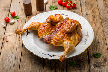 fried chicken tobacco on plate on wooden table