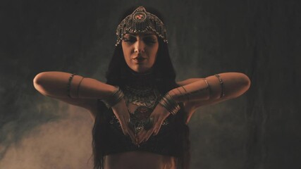 Sensual woman dancing in light and shadow