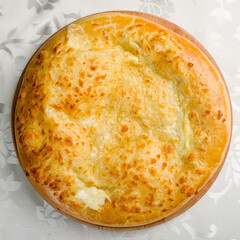 khachapuri with cheese, megrelian khachapuri, georgian cuisine on white table  top view