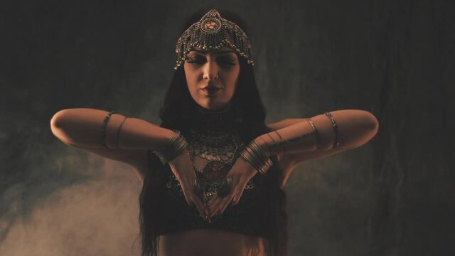 Sensual woman dancing in light and shadow