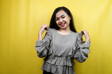 Beautiful young woman, with hands showing clothes, isolated