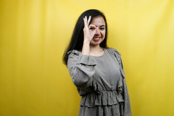 Beautiful young woman, with binoculars hands, peeking at something, isolated