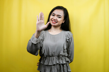 Beautiful young woman, with open palms, saying hello, how are you, isolated