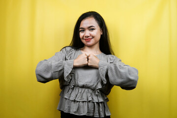 Beautiful young woman, with clenched hands, victory, isolated