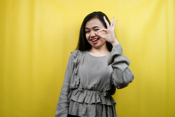 Beautiful young woman, with okay hands, good work, victory, isolated