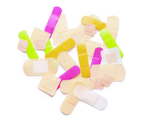 Many different medical plasters on white background