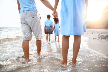 Happy family on sea beach