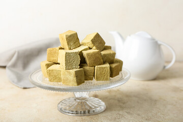 Stand with tasty hojicha marshmallows on light table
