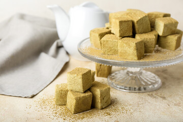 Stand with tasty hojicha marshmallows on light table