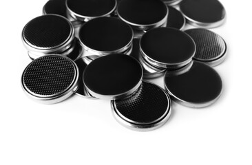 Lithium button cell batteries on white background, closeup