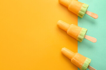 Tasty melon popsicles on color background