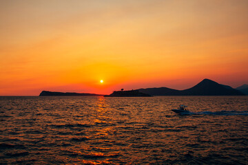 Naklejka na ściany i meble Red sunset sky over Mamula island. Montenegro