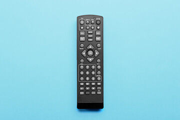 Modern TV remote control on blue background