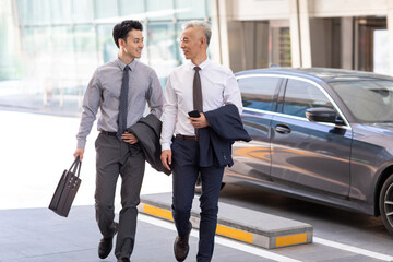 Confident business people walking outdoors