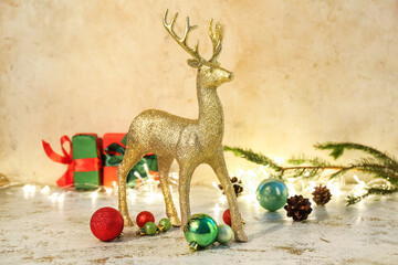 Golden reindeer with Christmas decor on grunge background