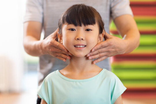 Little girl having exercise class in gym