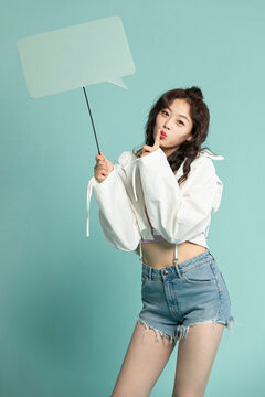 Studio shot of cute young woman