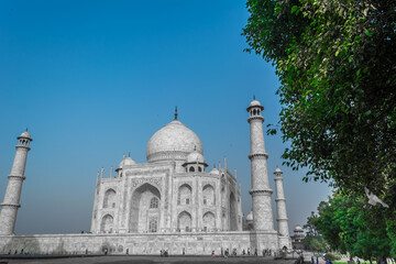 Fototapeta na wymiar The Taj Mahal is an ivory-white marble mausoleum on the bank of the Yamuna river in the city of Agra, Uttar Pradesh. 