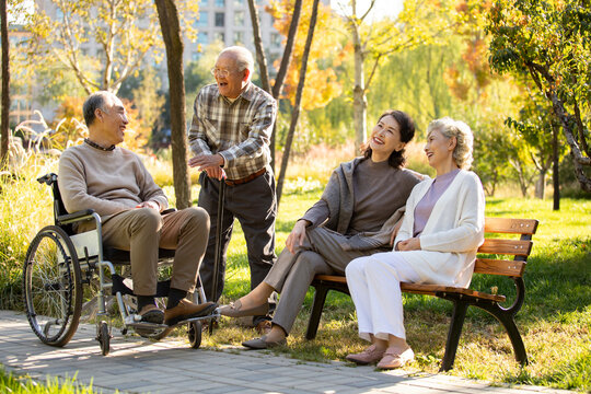 Cheerful senior adult relaxing in the park