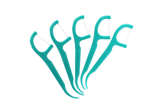 5 Green Dental Floss Picks (Plastic) isolated on a white background. Dental floss with handle, easy to use.