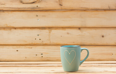 Mug on wooden background.selective focus.