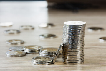 Stack of coin on work table,selective  focus.