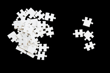 White jigsaw puzzle on black background.