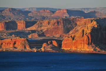 Sunset view of the buttes and cliffs around Lake Powell, over the state border in Utah, from the...