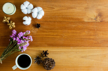Fototapeta na wymiar Nature flowers with coffee and nuts over the wooden table with nature light.