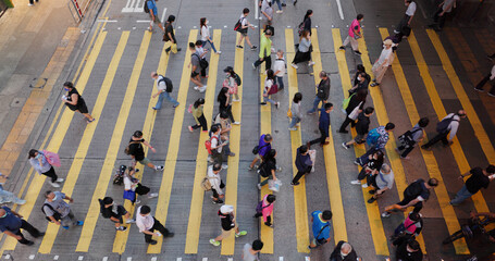 Top down view of people cross the street