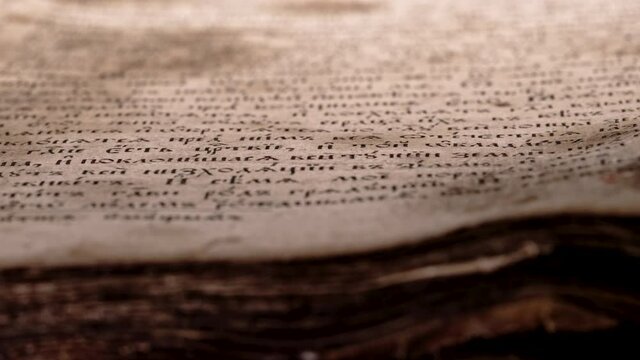 Old yellowed antique book close-up. Treasures of past. Museum piece from library. Orthodox psalter, 19th century, prayers and psalms.