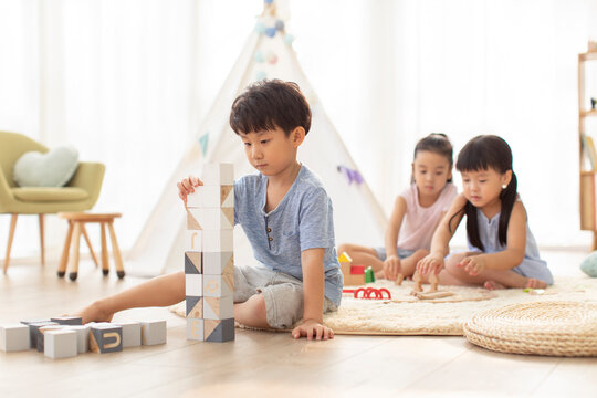 Cute Chinese children playing in living room