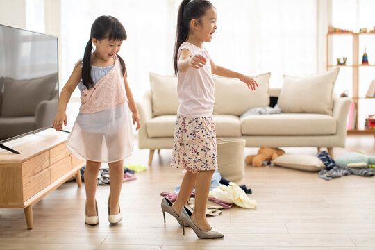 Cute Chinese children dressing up like adults
