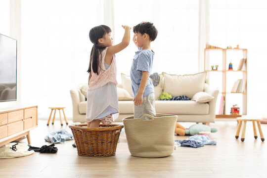 Cute Chinese children playing in living room