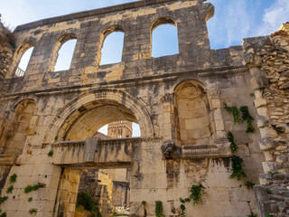 Giant stone wall with empty arched windows in structure surrounding Split, Croatia 