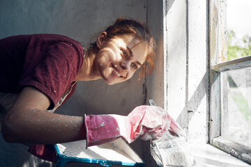 woman painter paint window home interior renovation