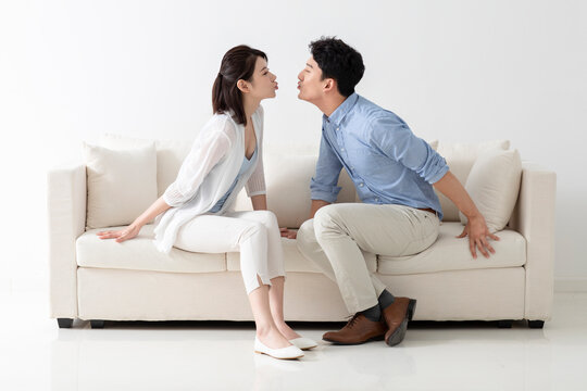 Cheerful young couple kissing