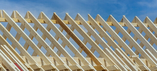 Wooden roof trusses of a house - obrazy, fototapety, plakaty