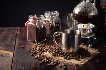 Metallic cup and vacuum coffee maker also known as vac pot, siphon or syphon coffee maker and...