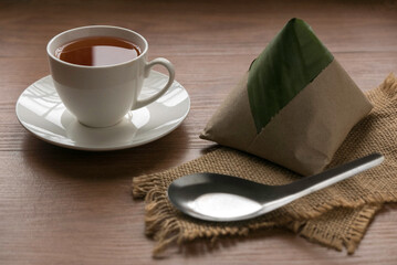 Nasi lemak , a popular malaysia breakfast serve with a cup of tea.