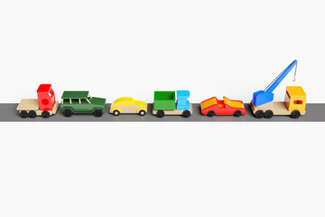 3d illustration of kids toys of a multicolored car, jeep, convertible, dump truck, truck and crane...