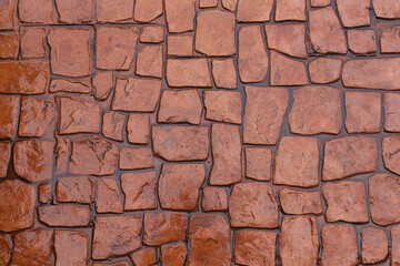 The light brown concrete floor is wet with a stone pattern.