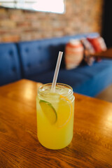 Large glass of lemonade in a nice cafe