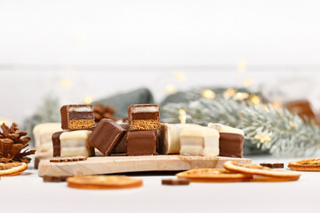 Christmas sweets called 'Dominosteine'. German candy consisting of gingerbread, jelly and marzipan layers covered with chocolate icing