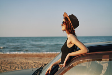 woman on the beach near car travel adventure summer