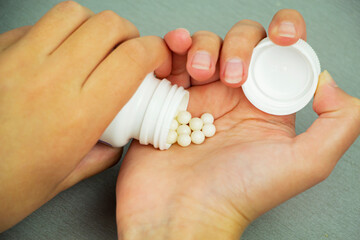 You have a handful of vitamins in your hand to boost immunity, vitamin C. Prevention of diseases. The virus.