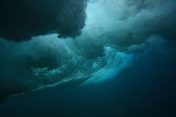 underwater turbulence of a breaking wave. - obrazy, fototapety, plakaty