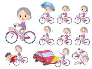 シティサイクルに乗ったジャージ高齢女性のセット