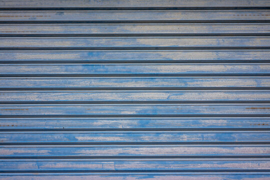 Background image of a blue dirty shutter